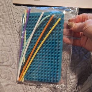 Blue Silicone Pegboard with Colorful Tubes